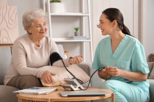 Senior woman with physical therapist measuring